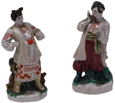 Lot 497 - A pair of 20thC Kyif porcelain figures of...