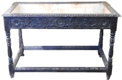 Lot 512 - A Victorian carved oak bijouterie table, with...