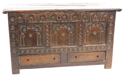 Lot 555 - A 17thC oak mule chest, with a three plank top...