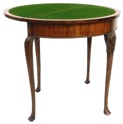 Lot 560 - An early 20thC Georgian style walnut demi lune...