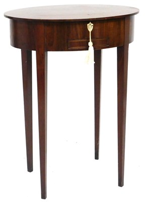 Lot 563 - A late Georgian mahogany oval drum work table,...