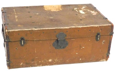 Lot 565 - An early 20thC canvas and leather bound trunk,...