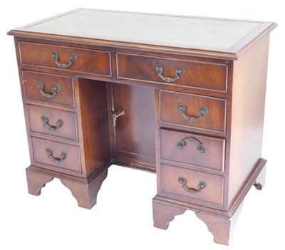 Lot 581 - A Georgian style mahogany kneehole desk, with...