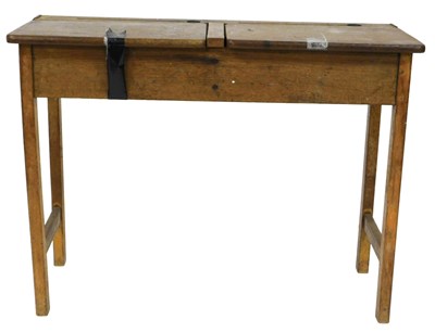 Lot 582 - An early 20thC oak twin pedestal school desk,...