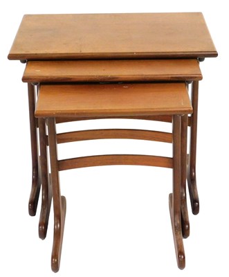 Lot 587 - A mid century G-Plan teak nest of occasional...