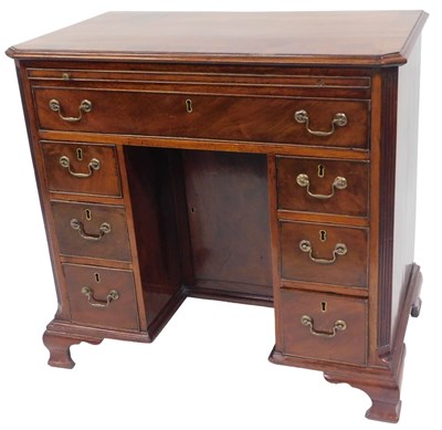 Lot 591 - A Georgian mahogany kneehole desk, with a...