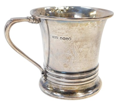 Lot 144 - A George V silver mug, with raised three...