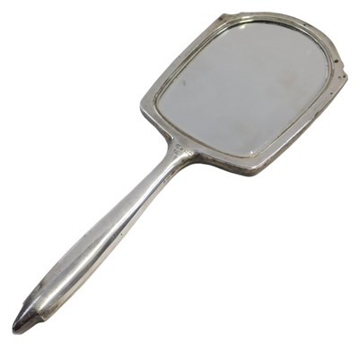 Lot 150 - A George V silver backed hand mirror, with...