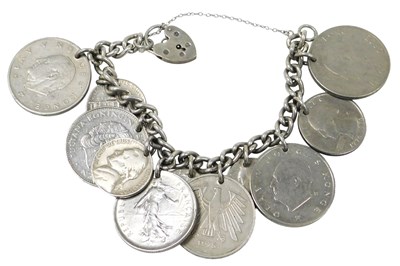 Lot 319A - A curb link bracelet, on a heart shaped...