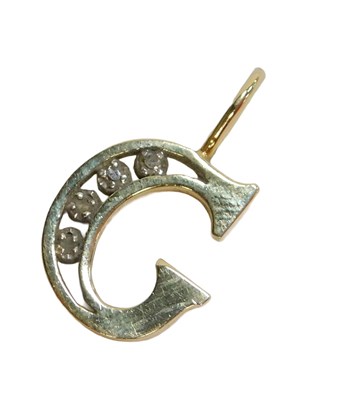 Lot 79 - A pendant, formed as the letter C, set with...