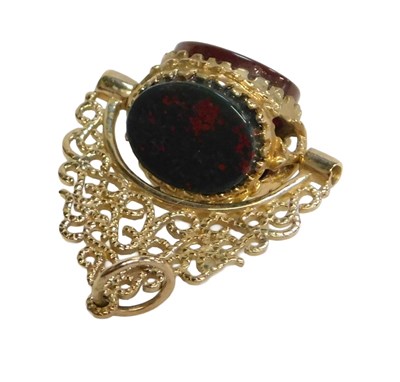 Lot 77 - A 20thC swivel agate fob, set with orange...