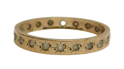 Lot 87 - A 9ct gold eternity ring, set with star set cz...