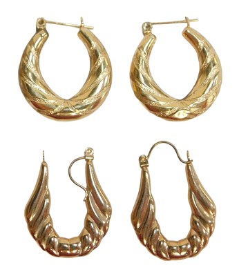 Lot 72 - Two pairs of hoop earrings, comprising an oval...