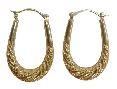 Lot 69 - A pair of hoop earrings, each with scroll and...