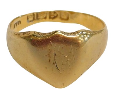Lot 62 - An 18ct gold signet ring, the central shield...