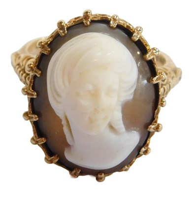 Lot 63 - A 9ct gold dress ring, set with an oval cameo,...