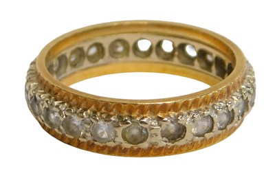 Lot 64 - An 18ct gold eternity ring, set with round...