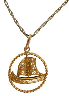 Lot 65 - A ship pendant and chain, the oval pendant...