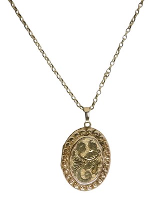 Lot 6 - A 9ct gold locket pendant and chain, the oval...
