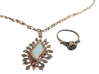 Lot 438 - A pendant and chain, set with an imitation...