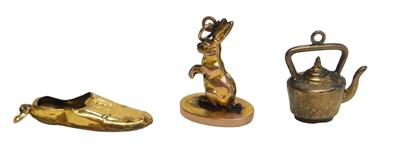 Lot 439 - Three charms, comprising a 9ct gold hare and...
