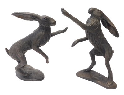 Lot 320 - A pair of 20thC bronzed resin boxing hare...