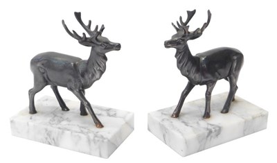 Lot 322 - A pair of bronze figures, each modelled as a...