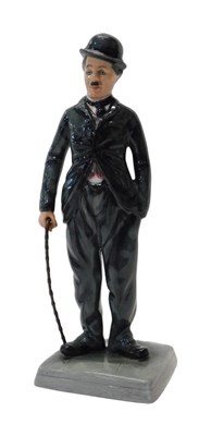 Lot 325 - A Royal Doulton figure modelled as Charlie...