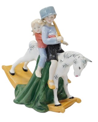 Lot 409 - A Royal Doulton figure modelled as Hold...