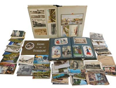 Lot 343 - An early 20thC postcard album, containing...
