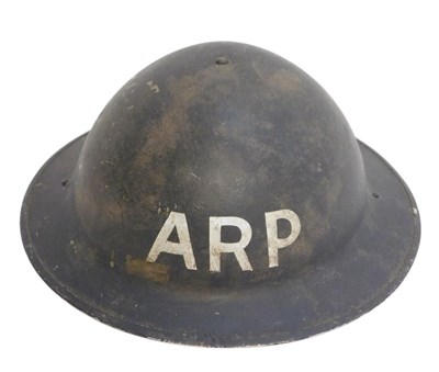 Lot 345 - A World War II ARP helmet, the chin strap...