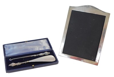 Lot 153 - An Edward VII silver handled shoe horn and...