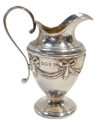 Lot 164 - A Victorian silver cream jug, of helmet form,...