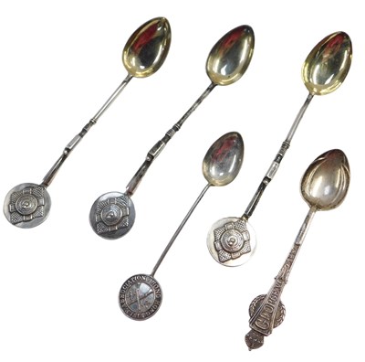 Lot 457 - Three commemorative teaspoons, the shafts...