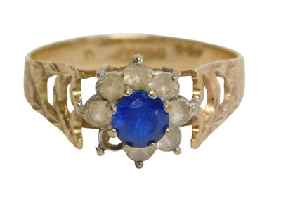Lot 258 - A 9ct gold cluster ring, set with white and...