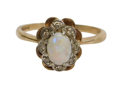 Lot 259 - A 9ct gold dress ring, set with central oval...
