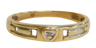 Lot 91 - A dress ring, the central panel with a heart...