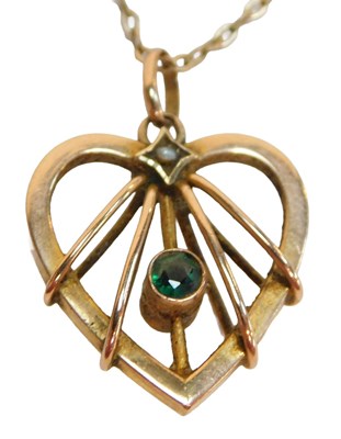 Lot 95 - A heart shaped pendant and chain, the yellow...