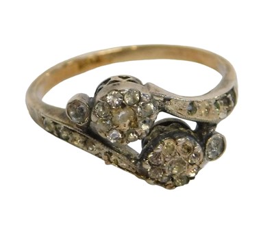 Lot 238 - A diamond set twist ring, of two cluster...