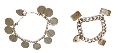 Lot 239 - Two silver charm bracelets, comprising a...