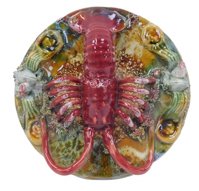 Lot 495 - A Portuguese Palissy-style plate, decorated...