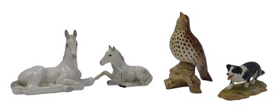 Lot 554 - A Beswick figure of a recumbent dapple grey...