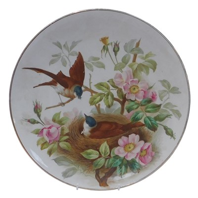 Lot 556 - A late 19thC pottery charger, handpainted with...