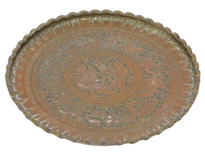 Lot 584 - An Indian copper and brass tray, with chased...