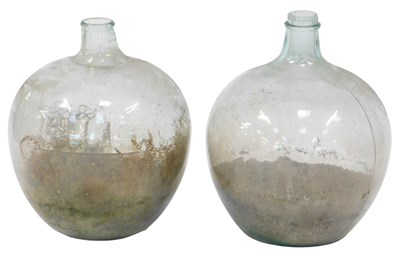 Lot 587 - Two similar glass demijohns, 58cm high and...