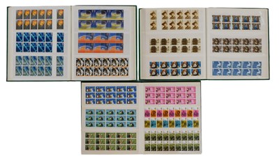 Lot 597 - Three albums containing Elizabeth II stamp...