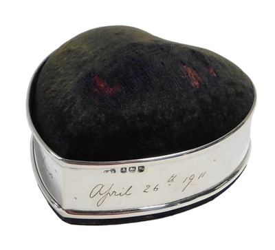 Lot 606 - An Edward VII silver-mounted heart-shaped pin...