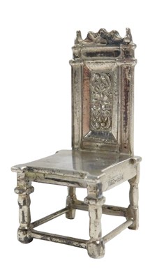 Lot 610 - A George V silver miniature chair, modelled as...