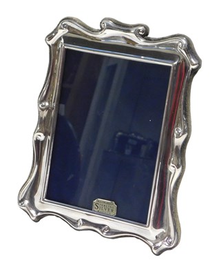 Lot 614 - An Elizabeth II silver mounted photograph...