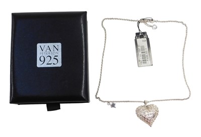 Lot 632 - A Van Peterson silver heart shaped locket, on...